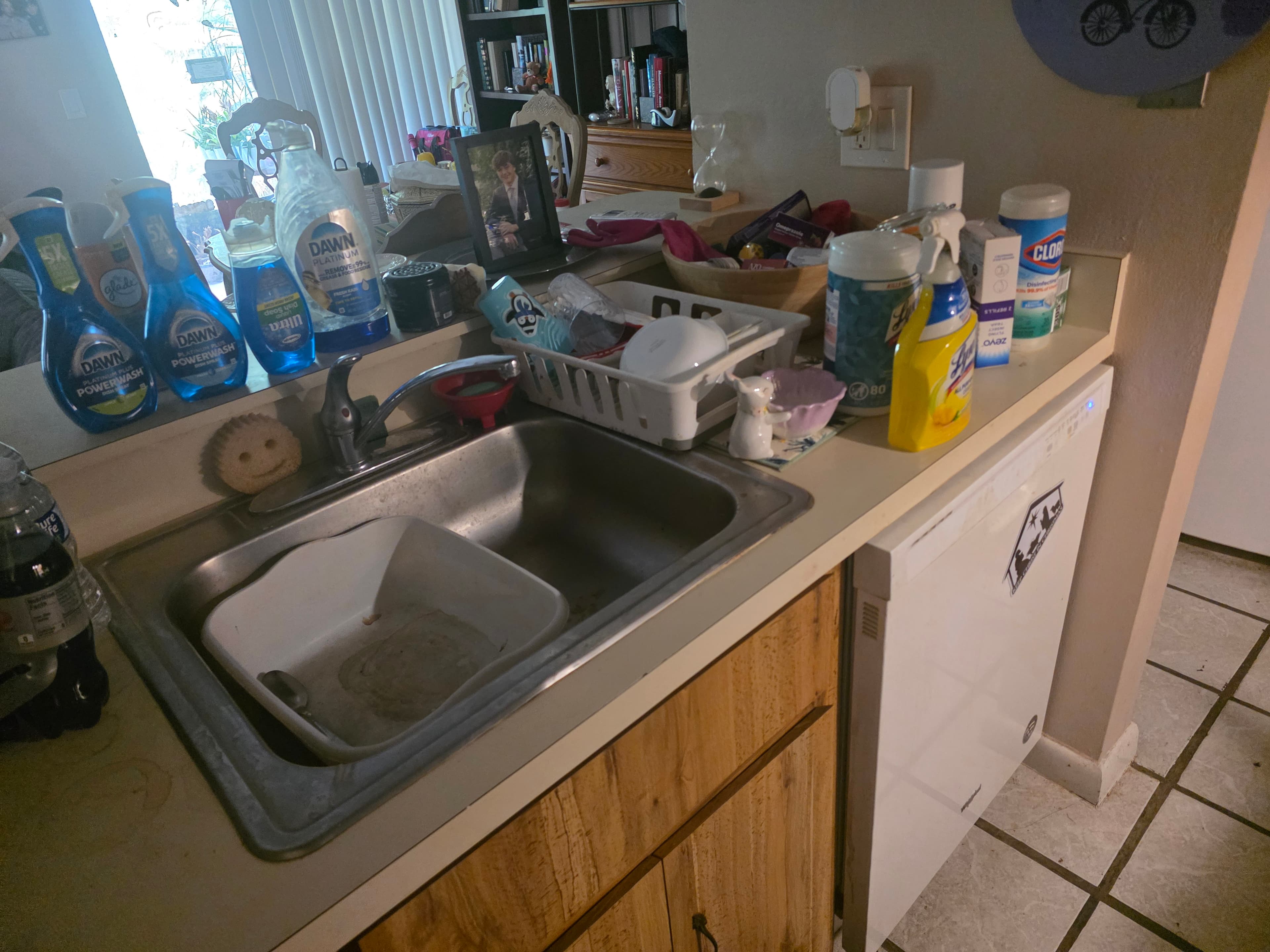 Client kitchen counters piled up before a Select Home Cleaning visit