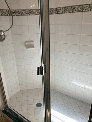 Sparkling glass shower in a real client home
